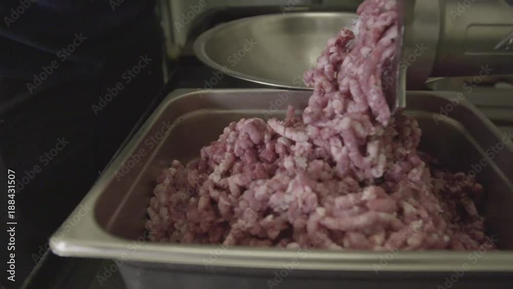 Pork in meat grinder, slow motion close up Pork in meat grinder, slow motion close up