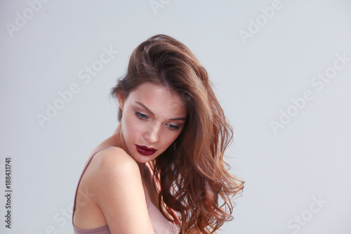 Portrait of beautiful woman , isolated on gray background.