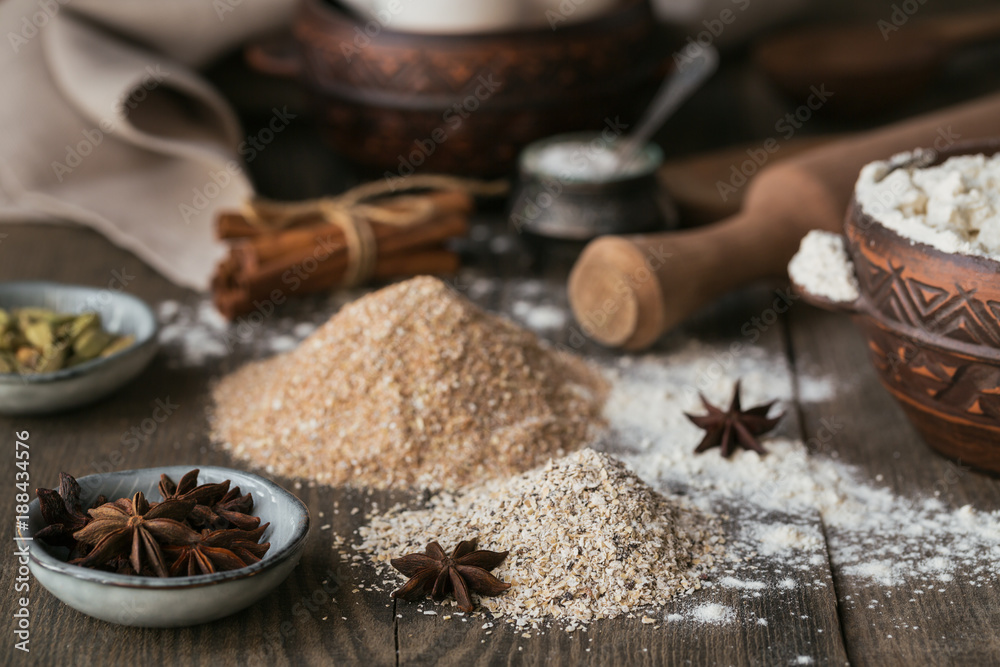 Ingredients for cooking bread or cookies: bran, flour and spices Ingredients for cooking bread or cookies: bran, flour and spices