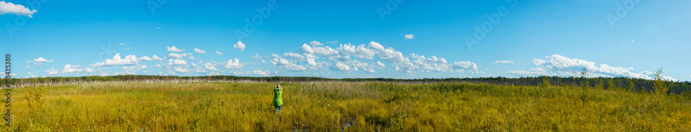  Tourist taking picture of a forest swamp
