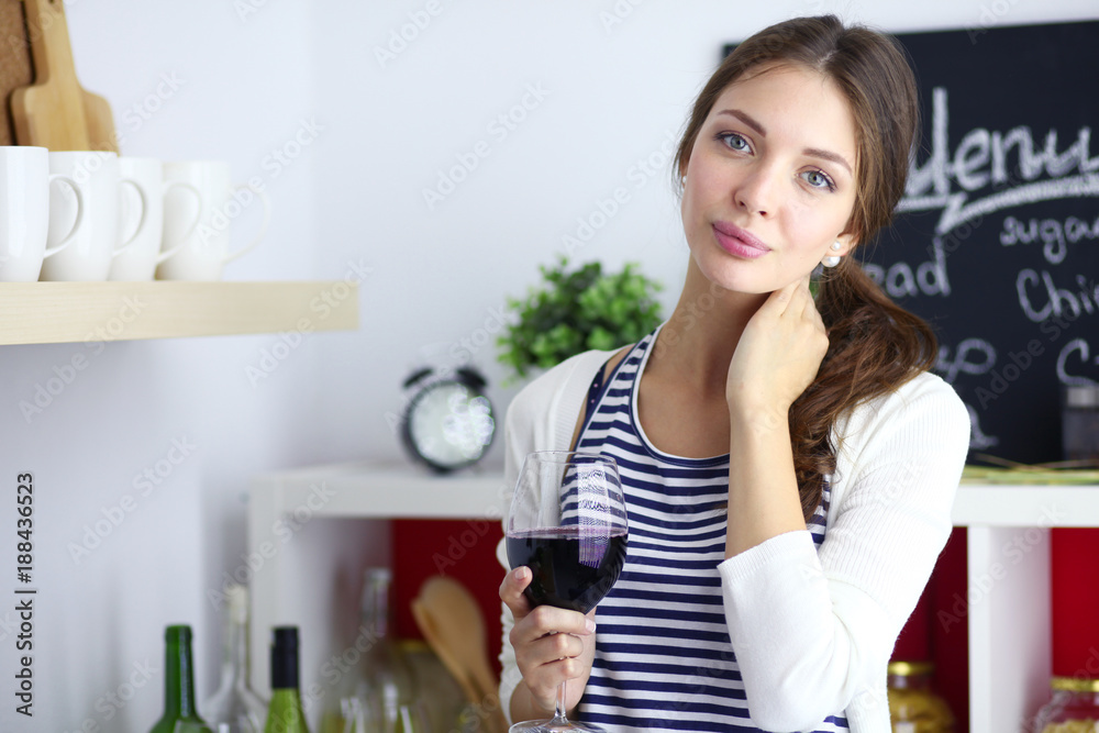 Young woman holding grocery shopping bag with vegetables .Standing in the kitchen. Young woman holding grocery shopping bag with vegetables .Standing in the kitchen.
