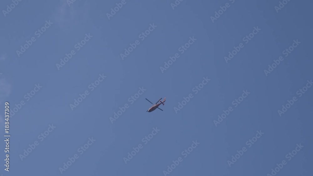 Rescue helicopter flying high in the sky Rescue helicopter flying high in the sky