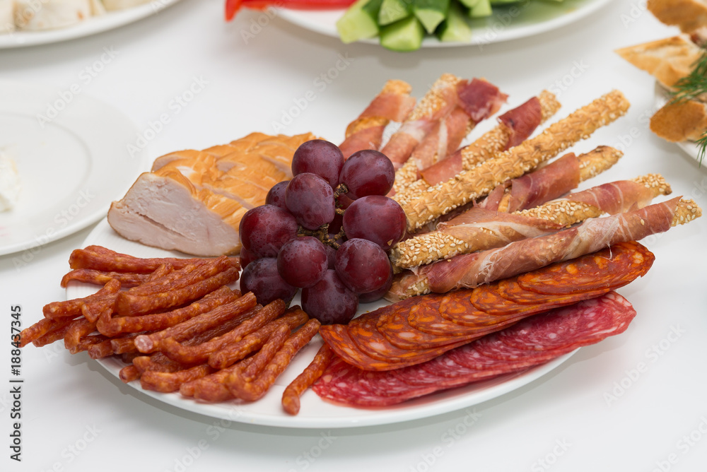 Plate full of meaty snacks.