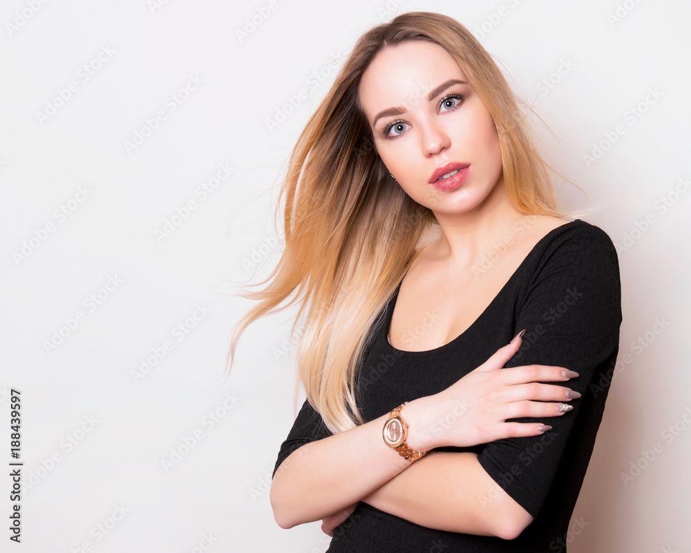 Fototapeta premium beautiful young woman with long hair wearing wrist watch
