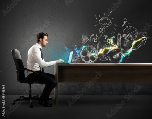 Slika na platnu Businessman in a desks works on a creative project
