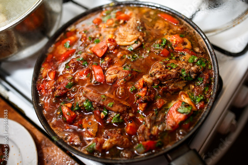Chakhokhbili. Chicken with herbs and tomato. photo