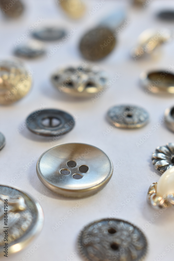 silver sewing buttons on white silver sewing buttons on white