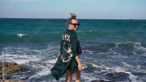Young Happy Girl Spreading Arms at Beautiful Sea photo