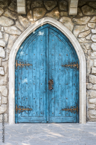 Turquoise entrance door in the medieval style © ale_flamy