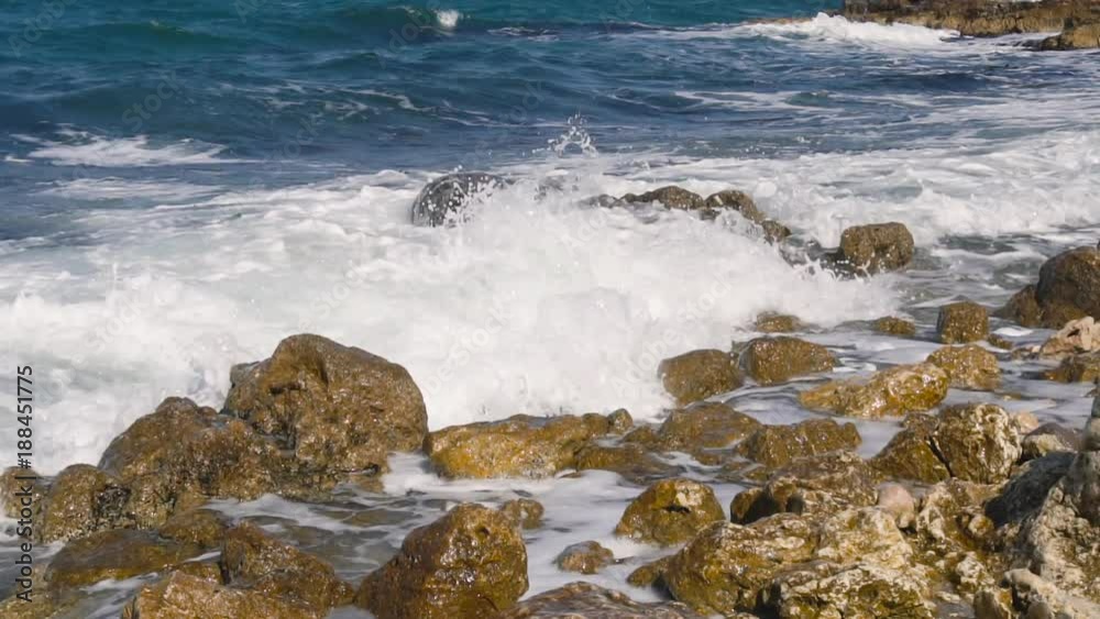 waves crashing on stone beach waves crashing on stone beach