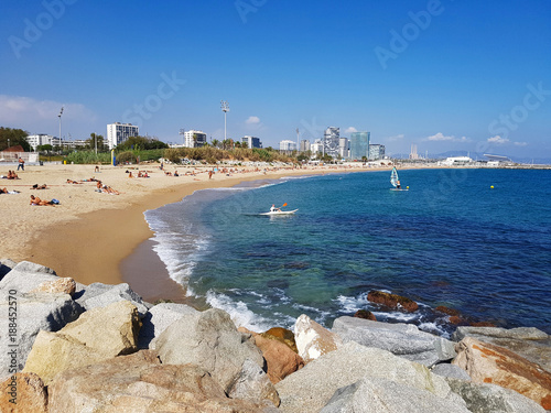 Photography Beach in Barcelona with blue sea and rocks