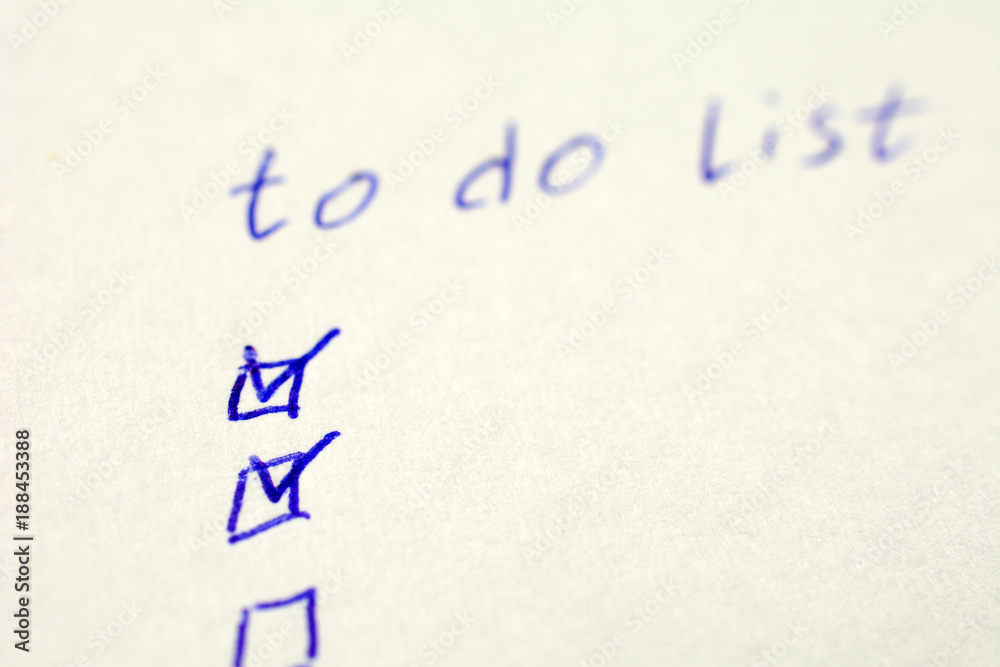 to do list on a white sheet of paper, pen notes completed check box. self management concept, close up, selective focus to do list on a white sheet of paper, pen notes completed check box. self management concept, close up, selective focus