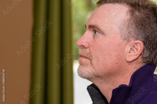 Portrait profile mature male in casaul setting photo