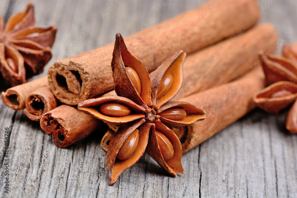 Cinnamon sticks with star anise on rustic table Cinnamon sticks with star anise on rustic table