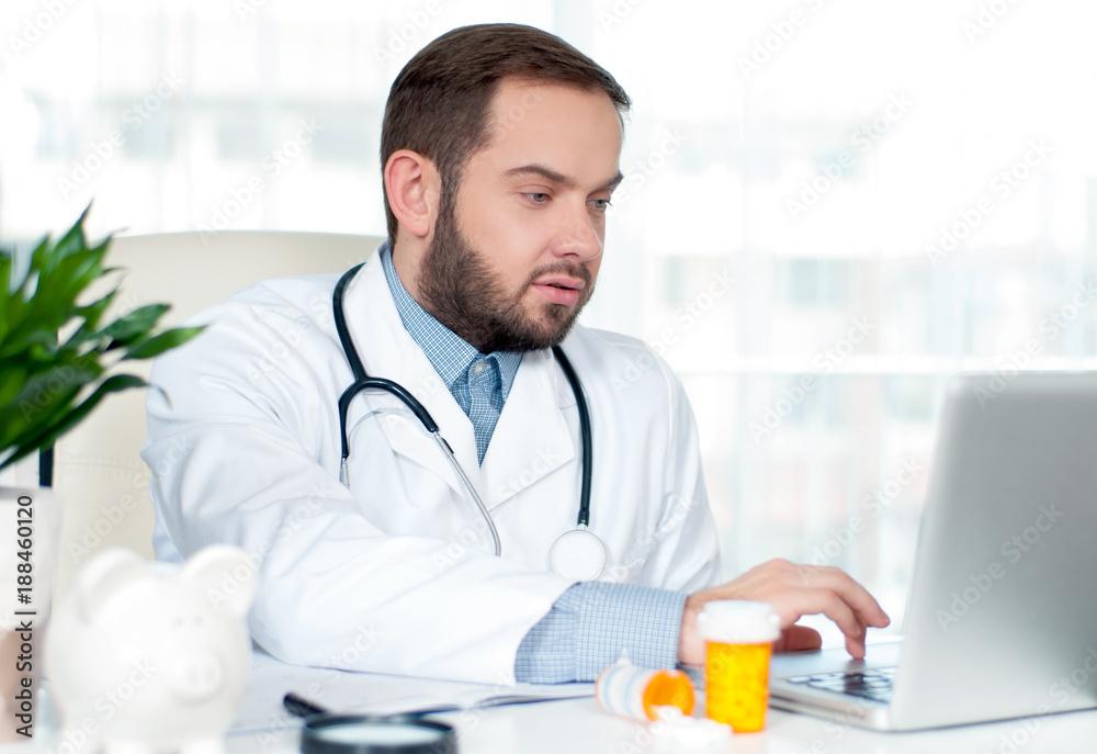 Doctor working with laptop computer Doctor working with laptop computer