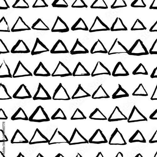 Vector abstract hand drawn seamless triangle pattern. Black and white doodle universal background made with watercolor, ink and marker. Trendy scandinavian design for fashion textile print.