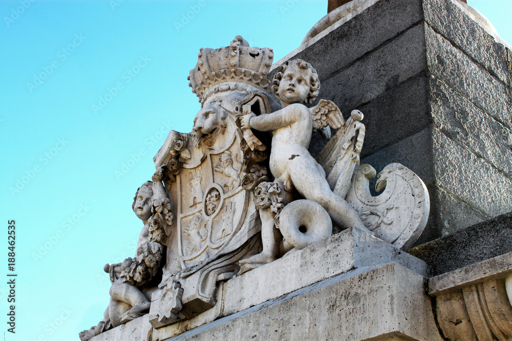 An ancient stone coat of arms in Madrid, Spain.