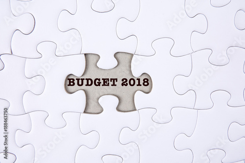 Business concept: Missing jigsaw puzzle with word BUDGET 2018.