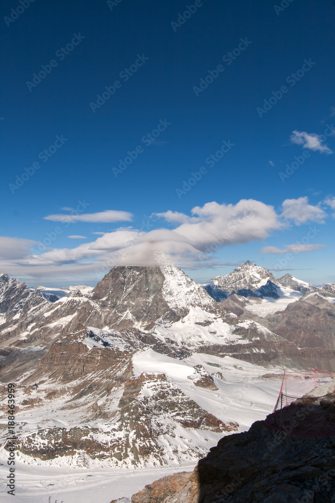 Winter panorama of mount Matterhorn covered with clouds, Canton of Valais, Alps, Switzerland 