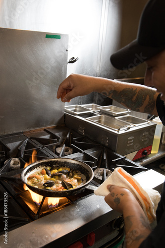 Chef over Grill with seafood