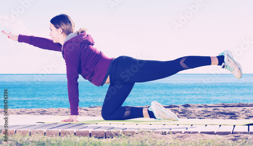 woman working out in beach