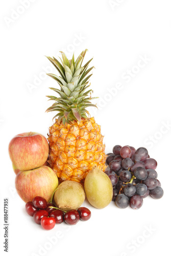 Many of the  fruits on white background pineapple.grape.kiwi.apple.cherry 