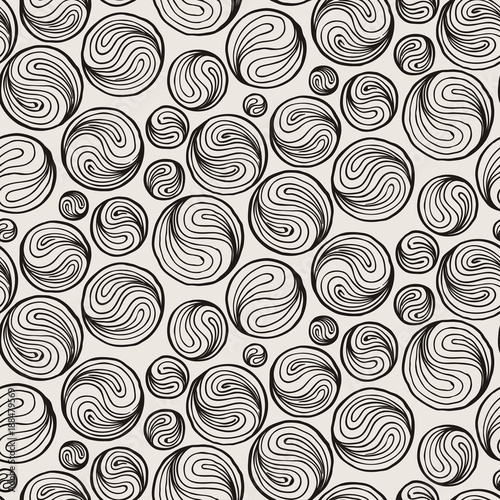 Seamless doodle print of moons or ing-yang