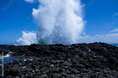waves crashing into rocks 