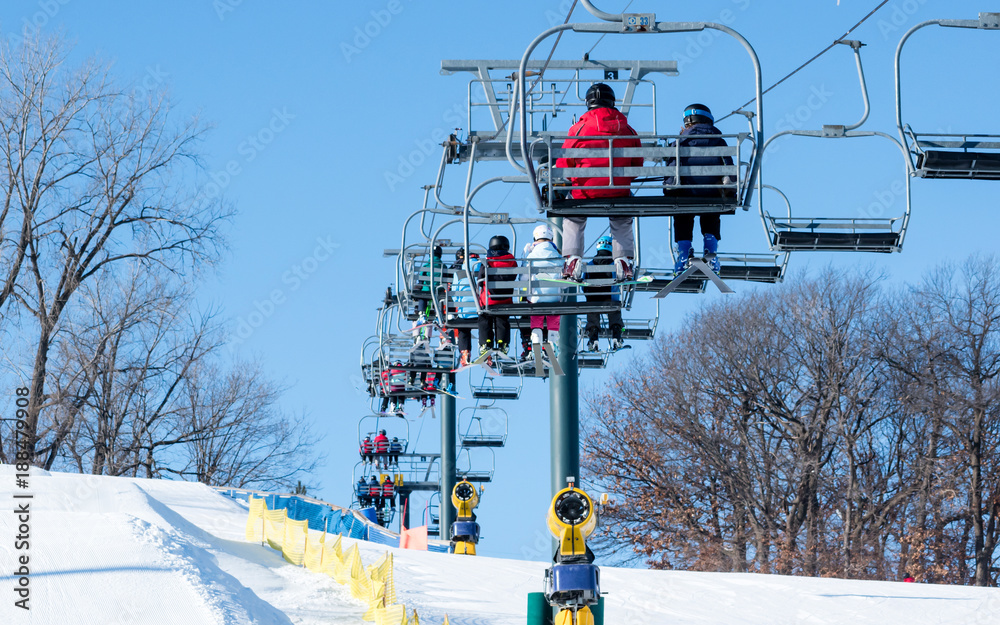 Naklejka premium People are having fun in downhill skiing and snowboarding