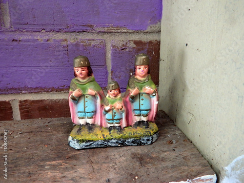 Triplet saints plaster figurines, regional beleif, Sts. Cosmas and Damian. photo