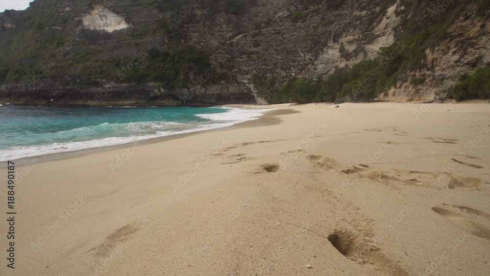 Tropical beach with turquoise water among the rocks, Karang Dawa, Nusa Penida Island, Bali, Indonesia. Travel concept. Tropical beach with turquoise water among the rocks, Karang Dawa, Nusa Penida Island, Bali, Indonesia. Travel concept.