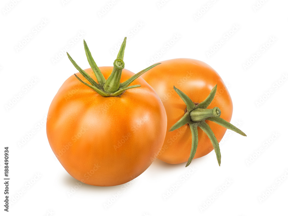 Two yellow tomato with green tail isolated on white background. Retouched tomato with texture, glare and shadow. Close-up view Two yellow tomato with green tail isolated on white background. Retouched tomato with texture, glare and shadow. Close-up view