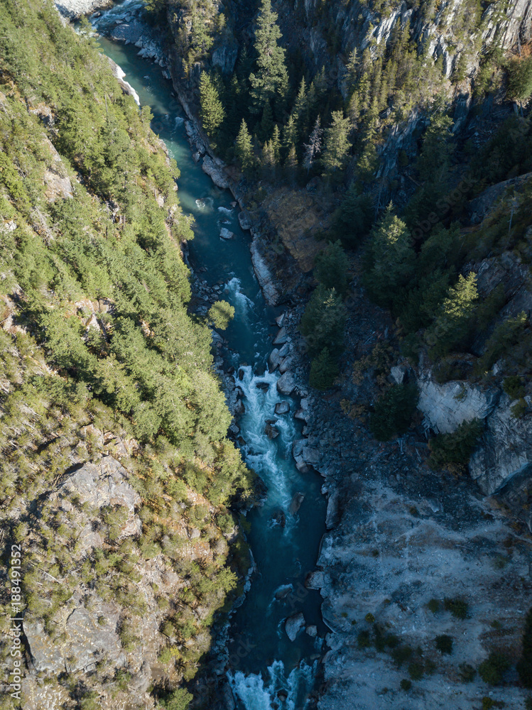 Aerial drone view of the beautiful canyon in the Canadian Landscape during a vibrant sunny summer day. Taken in Cheakamus, near Whistler, North of Vancouver, BC, Canada.
