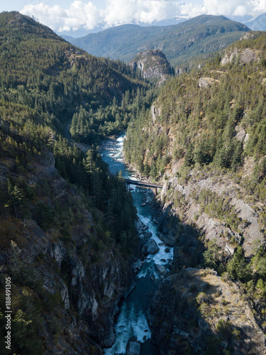 Aerial drone view of the beautiful canyon in the Canadian Landscape during a vibrant sunny summer day. Taken in Cheakamus, near Whistler, North of Vancouver, BC, Canada. 