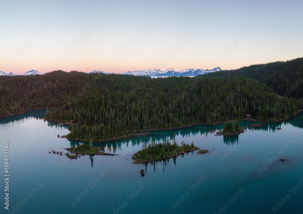 Aerial landscape view of the beautiful glacier lake during a vibrant sunrise. Taken in Garibaldi, near Whistler and Squamish, North of Vancouver, BC, Canada.