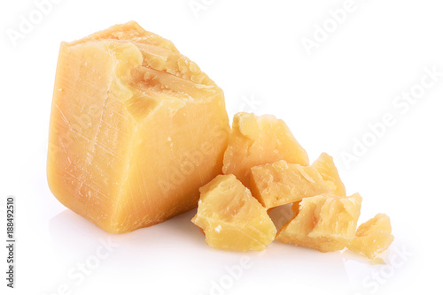 Pieces of parmesan cheese isolated on white background.