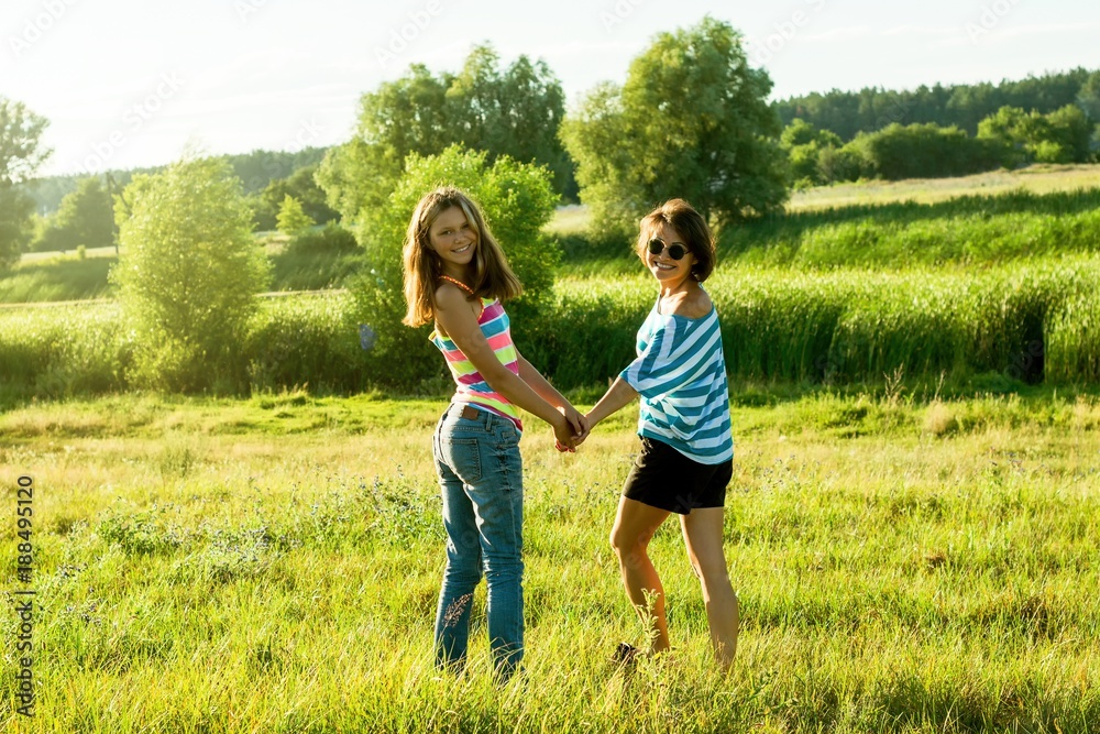 Mother and daughter holding hands. Mother and daughter holding hands.