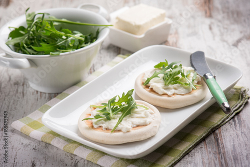 tigelle with stracchino and arugula, selective focus