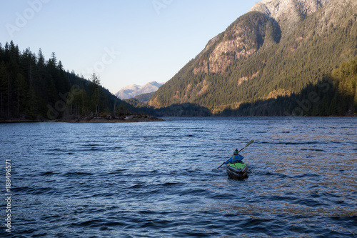 Girl Kayaking in a Lake. Taken in Buntzen Lake, Vancouver, British Columbia, Canada.