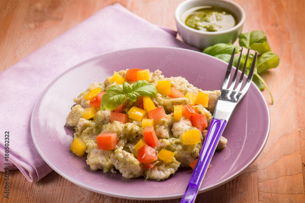 stew chicken with pesto sauce capsicum and tomato, selective focus stew chicken with pesto sauce capsicum and tomato, selective focus