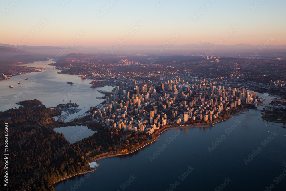 Naklejka premium Aerial view of Downtown City during a colorful and vibrant sunset. Taken in Vancouver, British Columbia, Canada.