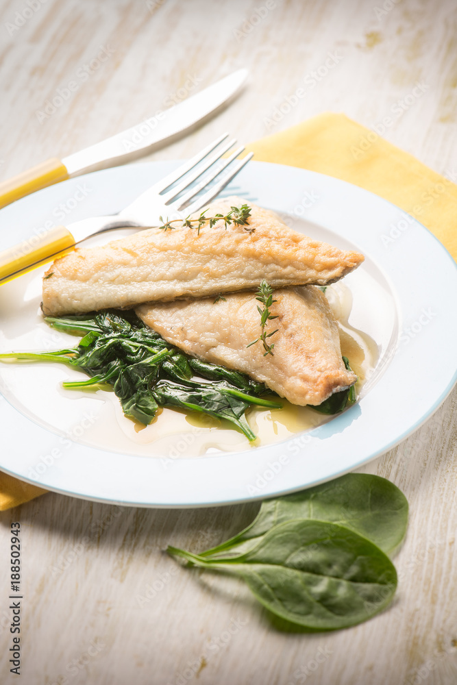 fish fillet with fresh spinach, selective focus fish fillet with fresh spinach, selective focus