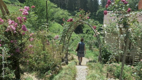 Young girl walking in tropical botanical garden. Batumi, Georgia photo