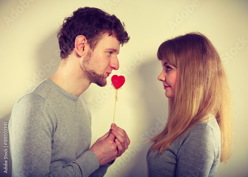 Man giving heart to his girl.
