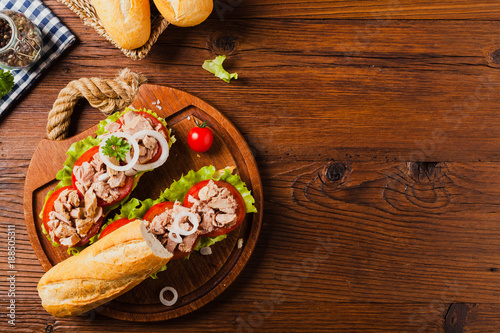 Delicious tuna sandwich, served with lettuce, tomato and onion.