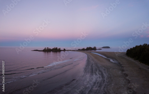 Aerial panoramic view of the beautiful Pacific Ocean Coast during a vibrant summer sunrise. Taken near Tofino, Vancouver Island, British Columbia, Canada. 