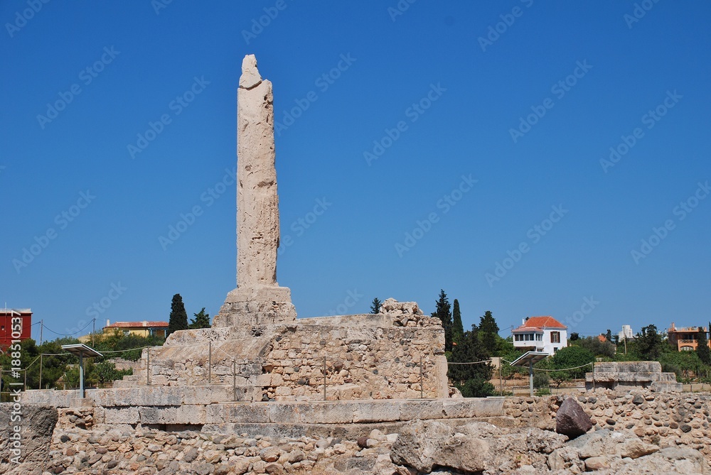 The remaining column of the ancient Temple of Apollo at Aegina Town on the Greek island of Aegina. The acropolis dates from circa 6th century BC.