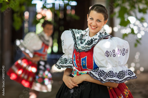 Keeping tradition alive: young woman in a richly decorated ceremonial folk dress/regional costume (Kyjov folk costume, Southern Moravia, Czech Republic) photo