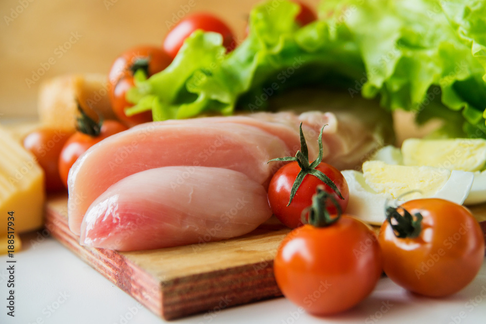 caesar salad and ingredients at table background