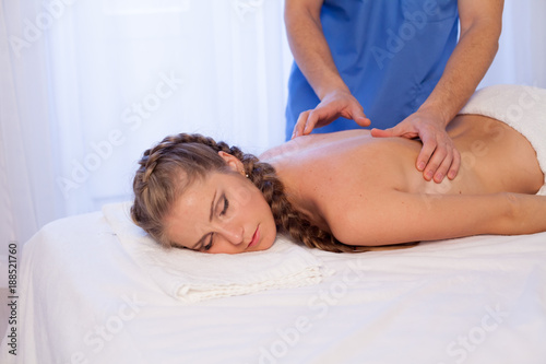 a woman doing a back massage in the Spa 1